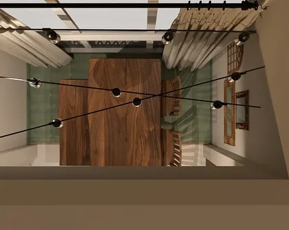 A top-down view from a 3D render, showing the layout of the dining area and the placement of the spider-like pendant light. This perspective is useful for understanding spatial relationships.