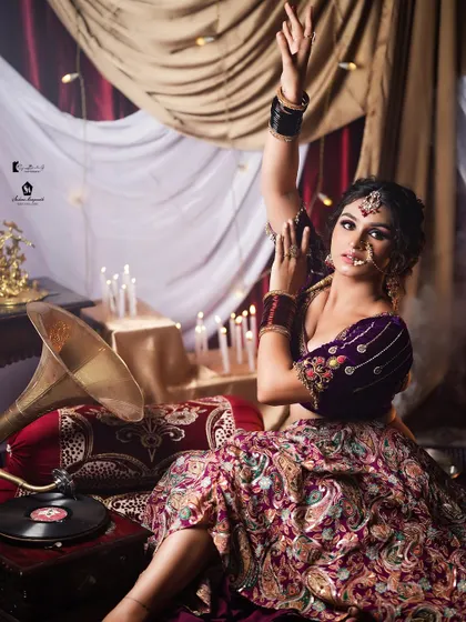 This shot incorporates a vintage gramophone to enhance the theme. You'll learn about concept creation for photoshoots.