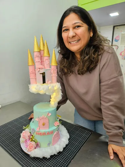 Me with a fairytale castle cake, complete with floating turrets.