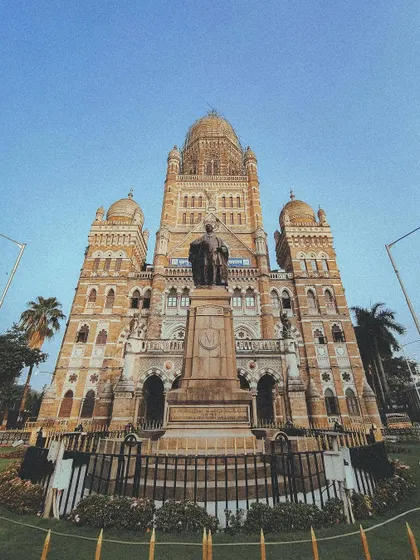 A low-angle, wide shot of the magnificent BMC building, emphasizing its grand scale.