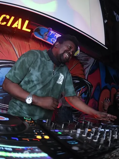 Bobkat looking happy behind the decks. We love what we do.