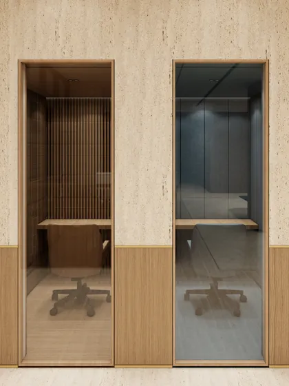 This render shows our design for private phone booths, offering soundproofed, quiet zones within an open-plan office. We used distinct materials like fluted wood and darker tones to visually separate these focus areas from the more collaborative spaces.