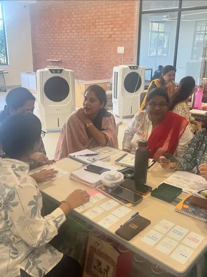 Teachers at DPS Hinjawadi working together, using my Yonjuu cards to explore mathematical strategies. The focus is on experiencing the learning process firsthand.