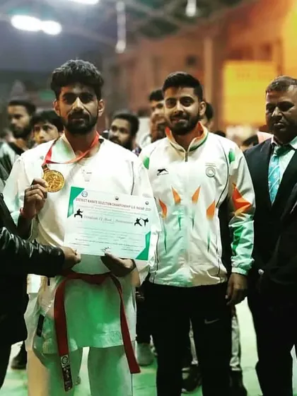 A moment of pride as my athlete receives his gold medal at the district championship. This is the reward for countless hours of dedication and disciplined training.