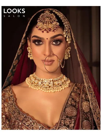 A captivating look for the modern bride. Here, we've focused on dramatic eye makeup with full lashes and a perfectly defined brow to create a powerful and memorable bridal statement.