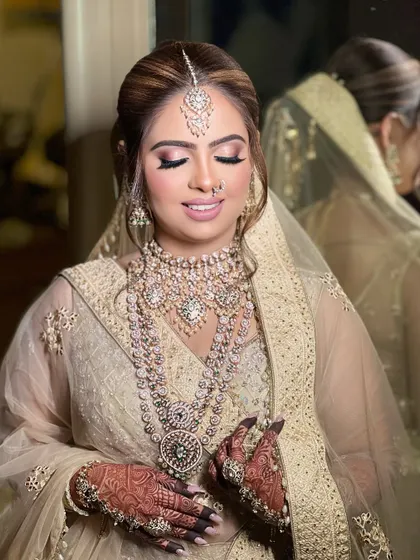 A final portrait of this stunning bride, her makeup flawless and her jewellery sparkling. This is a perfect look for a grand reception.