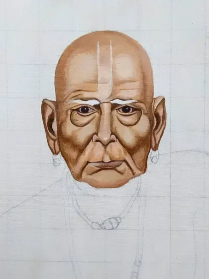 Here, I'm adding the tilak and building up the skin tones on the forehead. Each step involves carefully blending acrylics to create a smooth, realistic gradient.