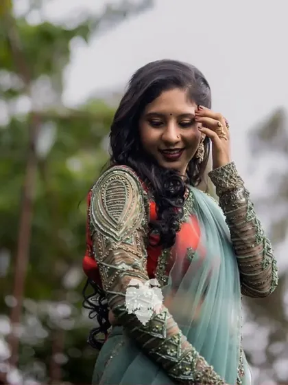 Sheer magic in these stunning full sleeves for Kritika Ranjit, blending sage green sheer fabric with an orange raw silk body.
