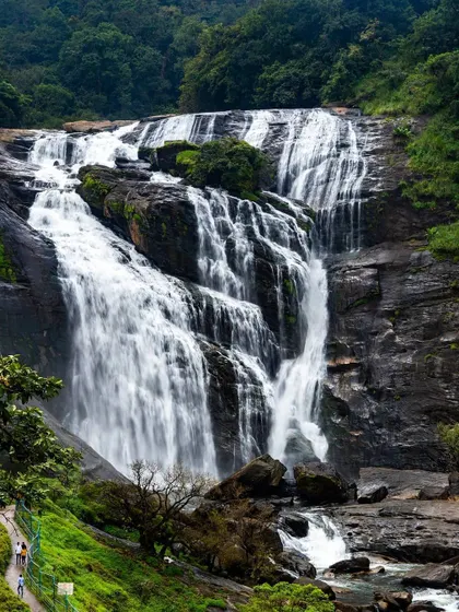The powerful rush of water cascades down the rocks at a majestic waterfall in Karnataka. This landscape shot beautifully captures the raw power and beauty of nature during the monsoon season.