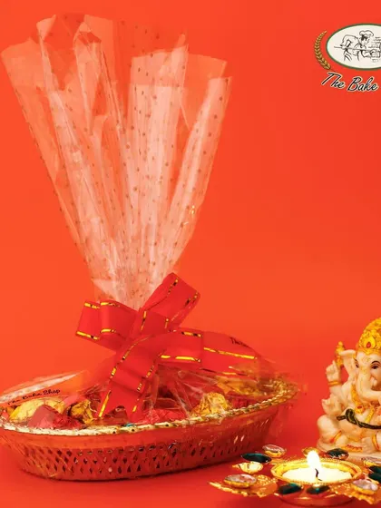 A festive basket filled with our Assorted Chocolate Rocks. This makes for a stunning and delicious gift, perfect for placing in a pooja room or as a centerpiece.