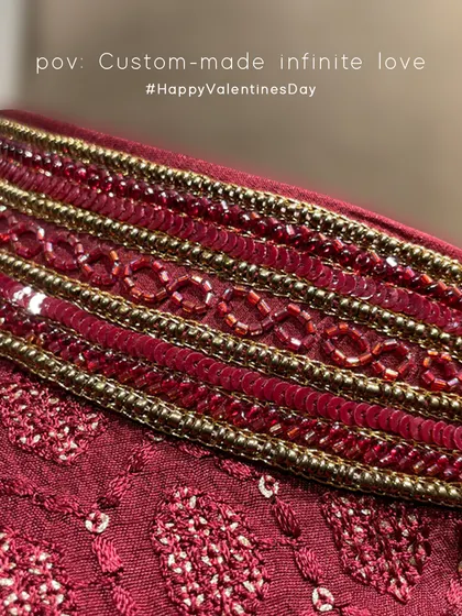 A close-up of the 'Infinite Love' bandi collar. The infinity symbol was a design concept from the father of the bride to portray the infinite love shared within their family.
