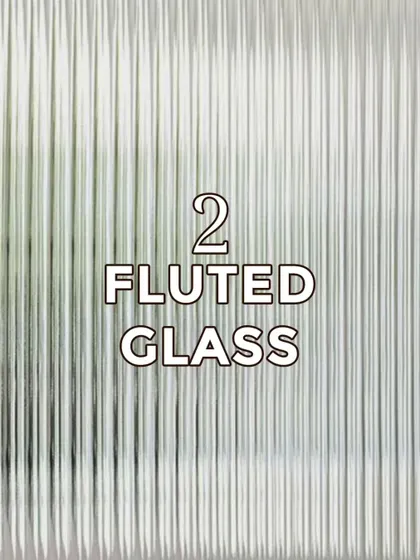 Fluted glass is our second trending material. Its vertical grooves offer privacy while allowing light to pass through, adding texture and elegance to doors and partitions.