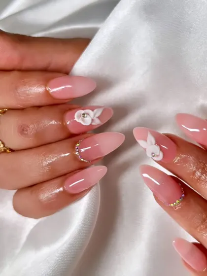 Another angle of these beautiful 3D floral nails, showing the detail of the sculpted flowers and the clean, glossy finish of the pink ombre extensions.