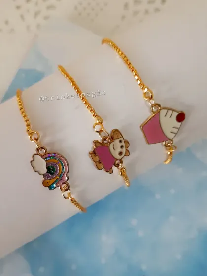 A view of the charm bracelets from the front, showing the cute pearl details that hang from the ends.