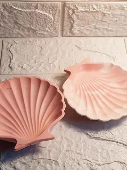 Two of our mini shell dishes in pretty shades of pink. One is a solid color, and the other has a soft marble effect.