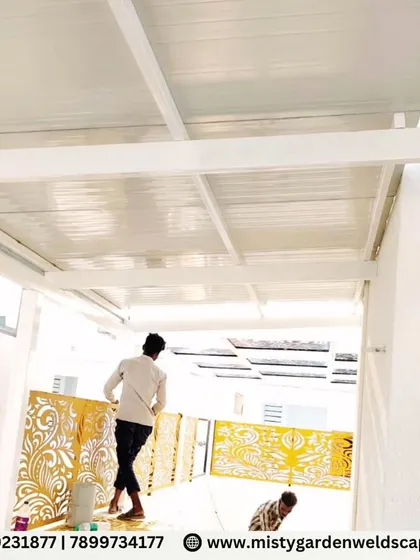 A luxury outdoor pergola at Natura Atavi, featuring a durable puff sheet roof for complete sun and rain protection. The design is enhanced with CNC designer panels, adding a bold architectural statement to this functional and stylish living space.