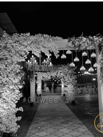 A black and white version of the beautiful floral entrance arch, highlighting its structure and texture.