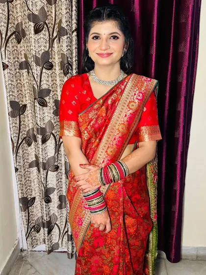 A beautiful Roka bride in a traditional red saree. I created a soft, natural look to celebrate her special day.