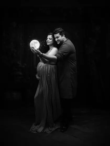 Holding the moonlight together. This magical black and white portrait blends fantasy with reality, creating a memory that feels both timeless and ethereal.