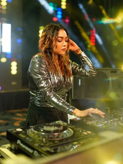 Adjusting my headphones to cue up the next track, ensuring the energy never stops.