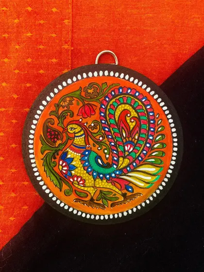 A small, 4-inch wall hanging featuring a colorful bird, perfect for gifting. This piece is detailed and vibrant, making it a lovely, affordable piece of art.