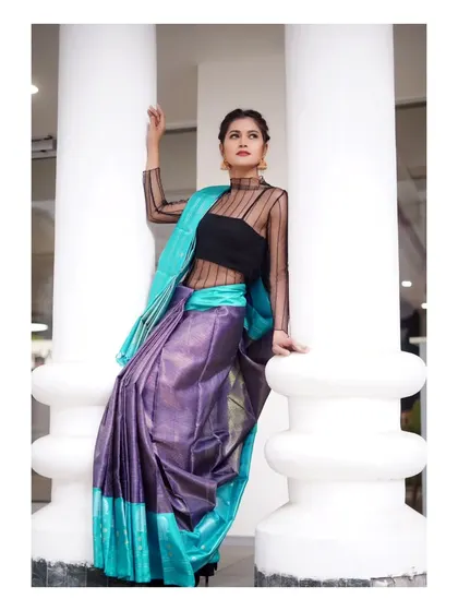 This shot uses strong architectural lines and a modern, sheer blouse to give a contemporary edge to a traditional Kanchipuram silk saree. It shows how I blend classic and modern elements in my commercial photography.