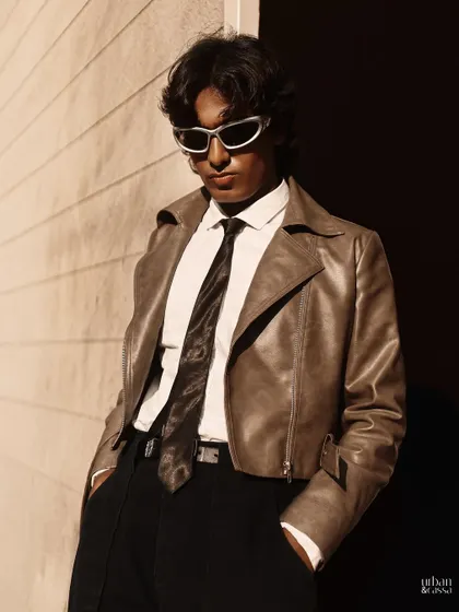 An edgier shot from the men's fashion series, with sunglasses adding a cool factor. The hair and skin are still clean and polished.