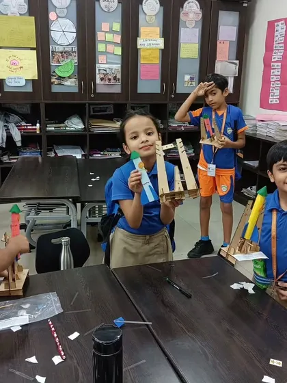 Another shot from a school STEM session, where students learn to follow instructions and assemble their own working rocket models.
