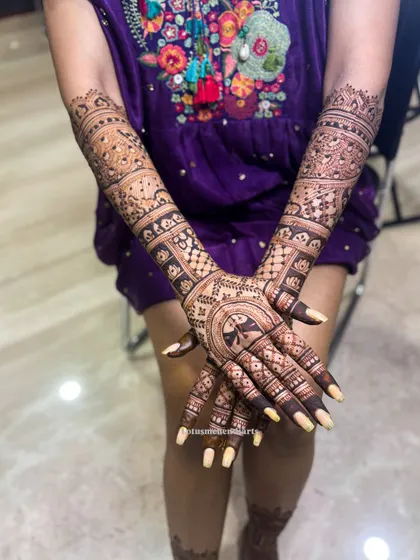 A different pose showing the complete back-hand design for Harshitha, highlighting the intricate details and the overall artistry.