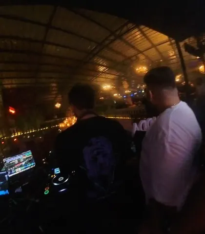 A duplicate shot showing the concentration of the VJ and DJ working together.