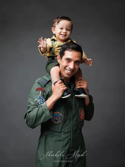 The world from dad's shoulders. This playful and loving portrait perfectly captures the fun and special bond between a father and his son.