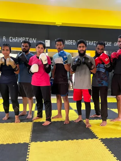 A group of our members ready for boxing training. Together, we rise and conquer, building skills and confidence with every session.