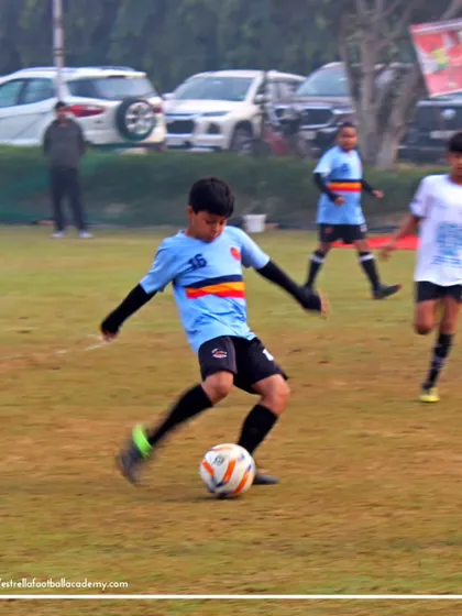A player making a run with the ball in a Golden League game. Our training focuses on developing dynamic players who are comfortable on the ball.