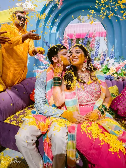 Covered in turmeric and love, the couple shares a sweet moment on their Haldi day.