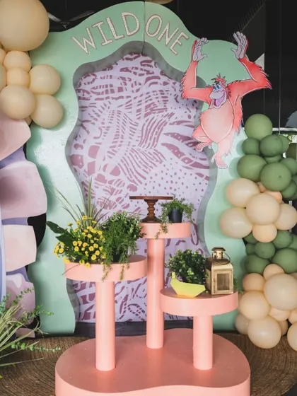 King Louie swings from a vine in this fun detail from the Jungle Book party, adding a playful and dynamic element to the decor.