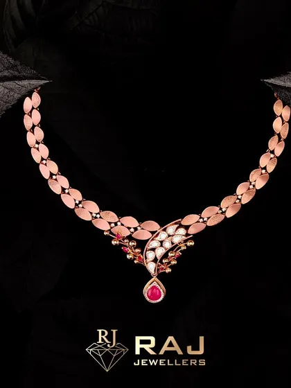 All that glitters is gold in this stunning Revaj necklace. The design features a chain of rose gold leaves leading to a delicate pendant of polki and a single ruby drop, creating a look of understated royalty and grandeur.