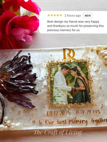 This beautiful resin plate was created to preserve a single lotus gifted by a fiancé, a symbol of a new beginning. I incorporated the couple's photo, initials, and the date of their first memory together. The five-star review from the happy client shows just how much these personal touches mean.