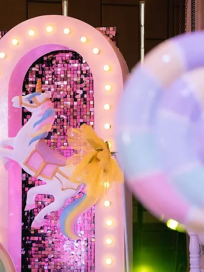 More details from the unicorn stage, including a large carousel unicorn, rainbow props, and pastel balloon arrangements. I love creating these immersive, picture perfect settings.