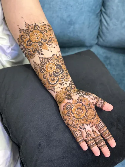 A full-coverage floral design with bold, shaded roses and intricate fillers.