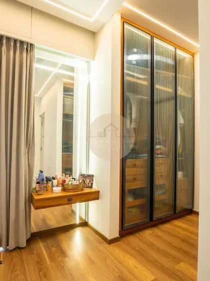 A collection of our custom wardrobe designs, showcasing different finishes like glass, laminate, and wood, as well as various internal configurations to meet the specific storage needs of our clients.