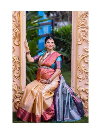 Using props like this ornate frame adds a creative and elegant touch to the photoshoot. This seated portrait is both regal and relaxed, showcasing the mother-to-be in a beautifully composed setting.