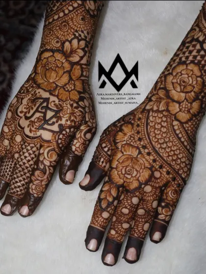 A close up of a bridal palm with the couple's initials 'A' and 'Z' beautifully integrated into the floral design.
