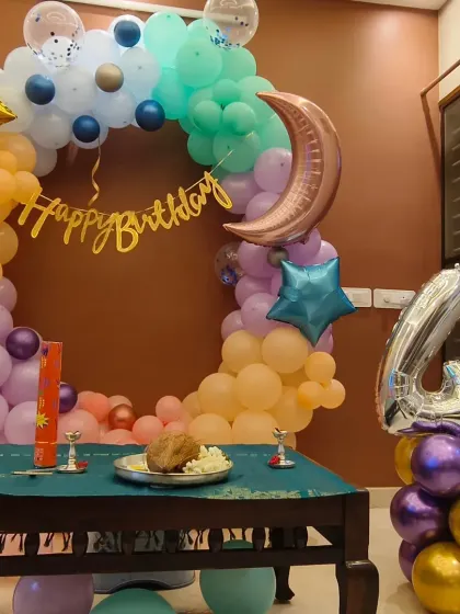 A close-up of the moon and stars birthday setup. The traditional plate with coconut shows how I can incorporate cultural elements into modern decor.