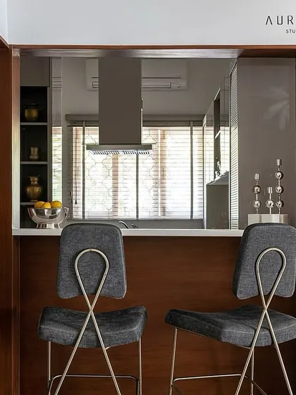 Another shot of the bar and pass-through, highlighting the sleek design of our bar stools which complement the modern kitchen aesthetic.