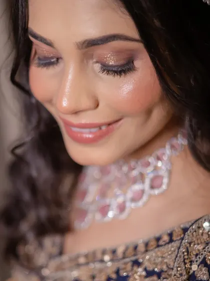 A close-up of the eye makeup for the sangeet. A beautiful blend of neutral tones with a touch of glitter on the lids creates a look that is both glamorous and elegant.
