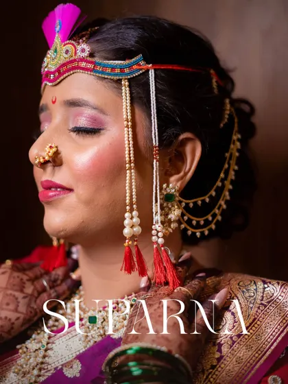 A beautiful close-up portrait of the bride, Suparna, showcasing her traditional Maharashtrian bridal jewelry, including the mundavalya and nath.