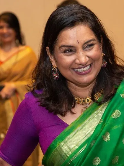 A candid photo of Gayathri Shetty enjoying the book launch event.