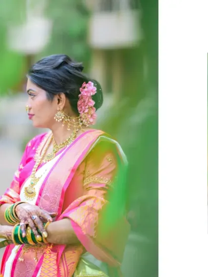 A side profile of the bride, looking away thoughtfully, with a soft, green foreground creating a dreamy effect.