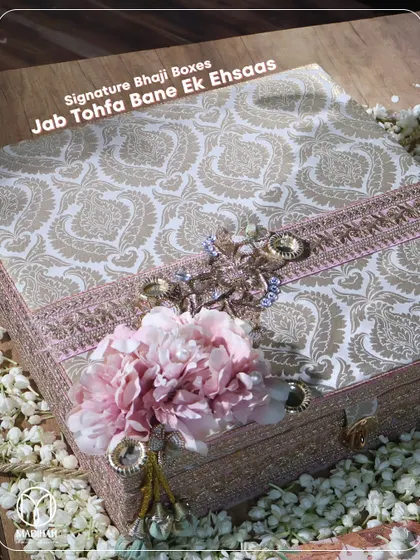 Jab tohfa bane ek ehsaas. The exterior of one of my signature Bhaji boxes, featuring a beautiful paisley fabric, intricate floral and crystal embellishments, and a traditional clasp.