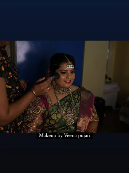 The beginning of a bridal transformation. Here, I am applying the foundation, the key to achieving that flawless base for a long-lasting muhoortham look.